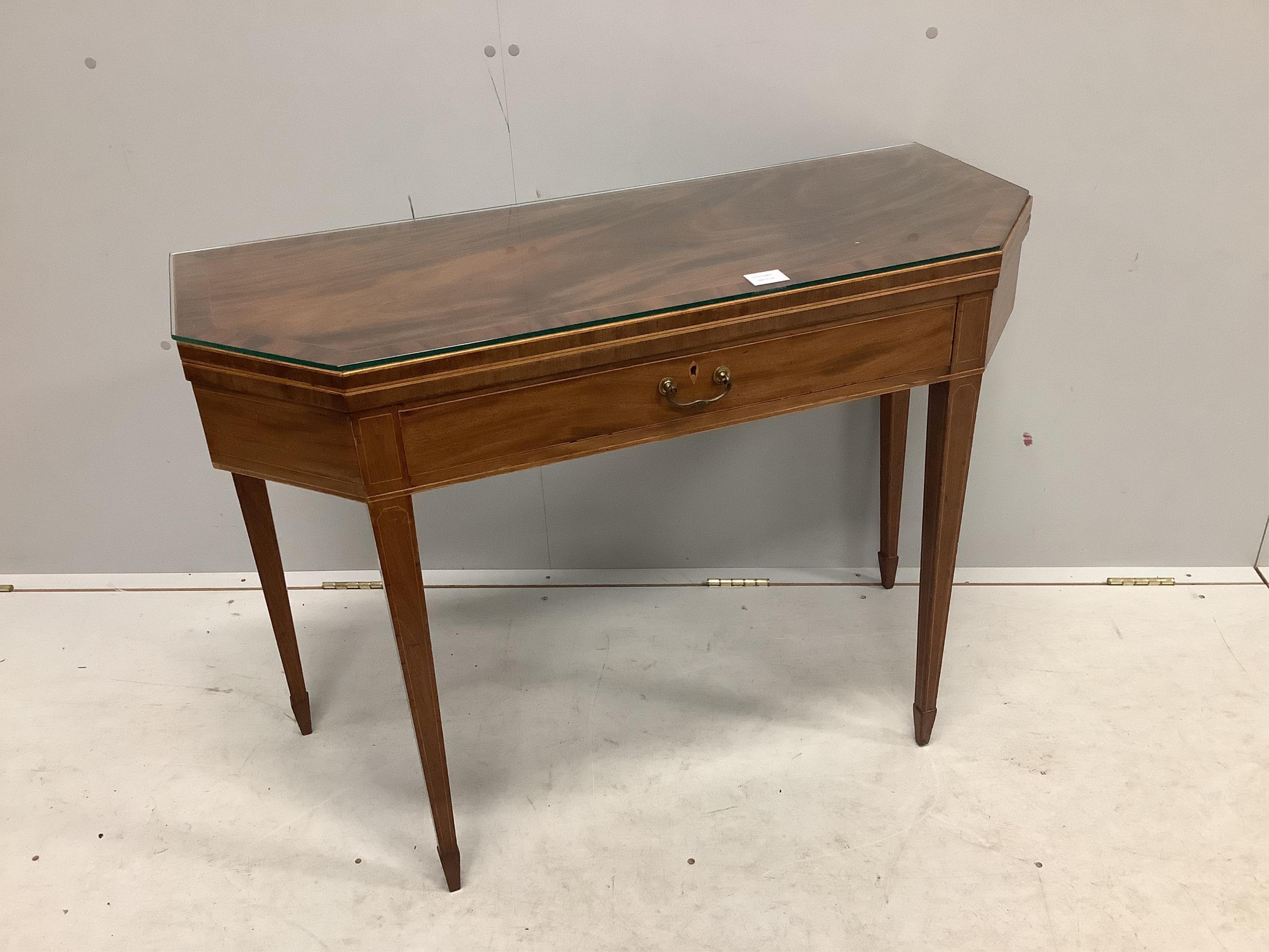 A George III mahogany folding tea table with frieze drawer, width 101cm, depth 41cm, height 73cm. Condition - fair to good